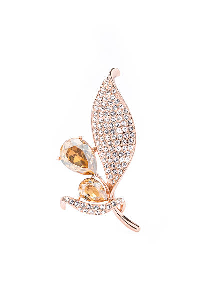 istock gold leaf brooch with topaz and diamonds on white background 510331168