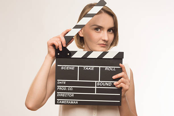 istock young girl with a clapperboard cinema 510333813