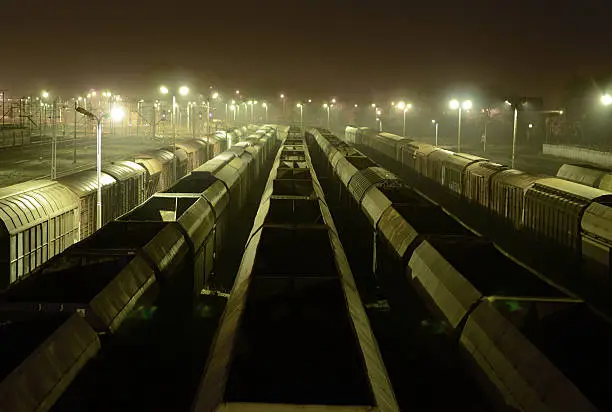 Freight Station with trains, cargo transportation at night