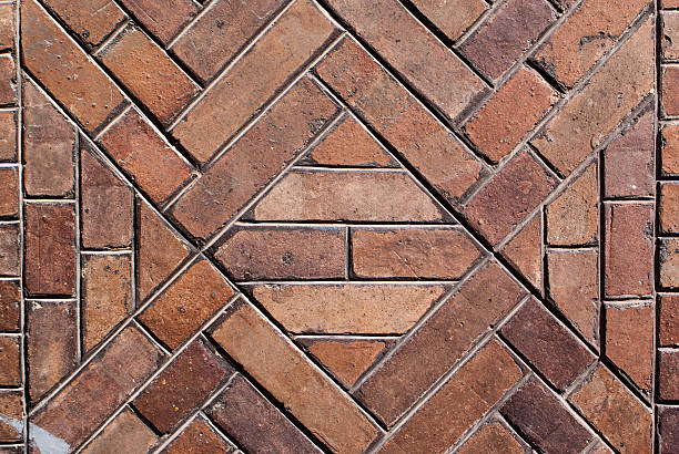 istock Weathered stained old brick wall background 510336157