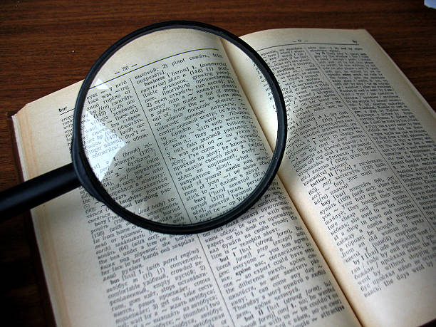 istock book and magnifying glass 510337955