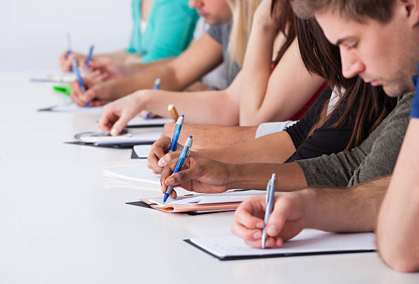 istock University Students Writing At Desk 510338573