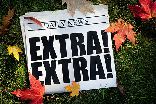 istock Autumn EXTRA! Newspaper on Grass with Fall Leaves 510351923