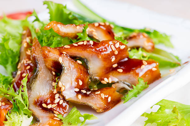 istock Salad with smoked eel and unagi sauce 510351999