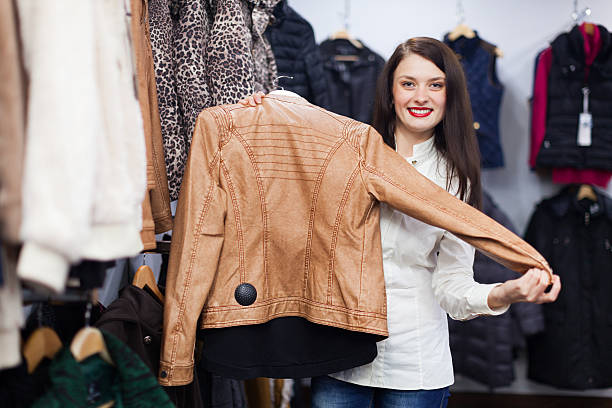 istock Young woman choosing jacket 510354423