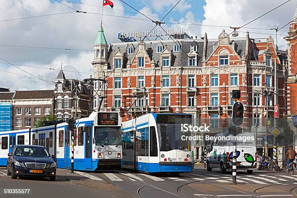 Busy Intersection With Trams In Amsterdam Stock Photo - Download Image Now - Traffic Jam, Amsterdam, City