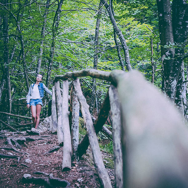 istock Girl walking in the forest 510356623