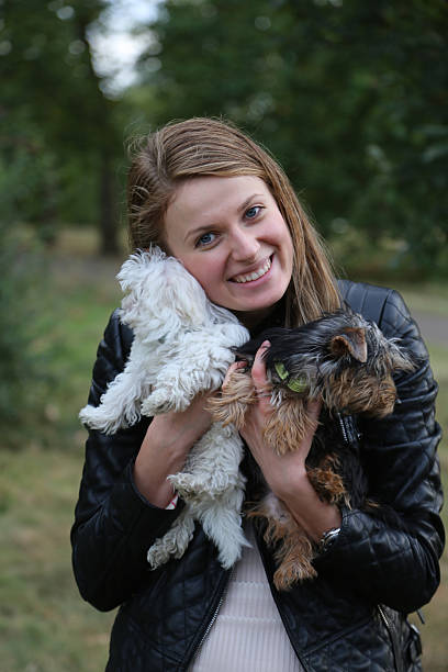 istock Woman holding puppy 510357059