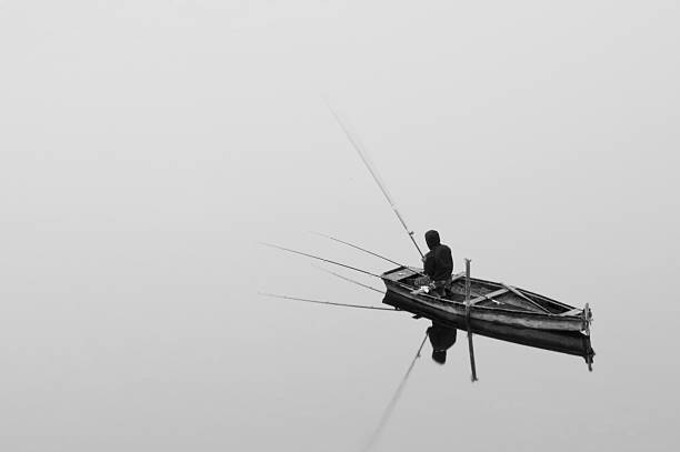 istock fisherman on the lake 510357495