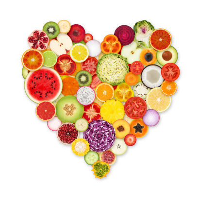 Healthy heart food high in flavonoids, polyphenols, antioxidants, anthocyanins, lycopene, vitamins, proteins, bioflavonoids, minerals, fibre. On rustic wood background.