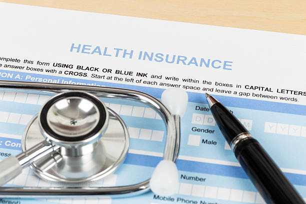 istock Health insurance application form with pen and stethoscope conce 510359287
