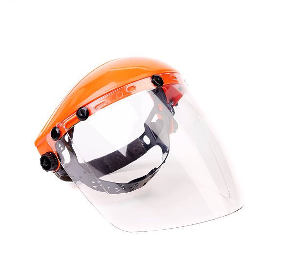 Orange protective mask. Orange protective mask isolated on the white background. welding mask stock pictures, royalty-free photos & images