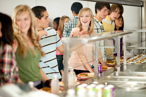 cafeteria - early teens teenager adult student people in a row fotografías e imágenes de stock