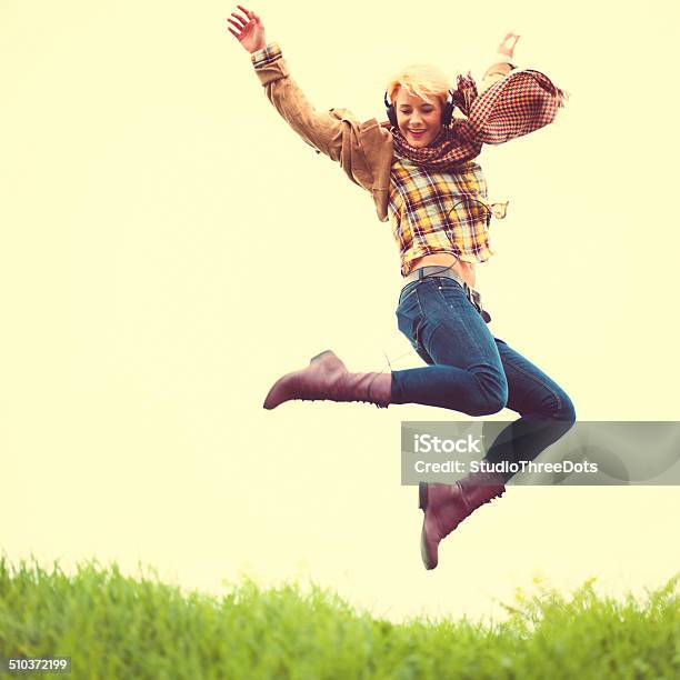 Young Woman Jumping Outdoors Stock Photo - Download Image Now - 25-29 Years, Activity, Adult