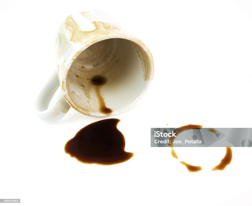 Coffee Stains Coffee stains on white background with overturned cup. Horizontal. Brown Stock Photo