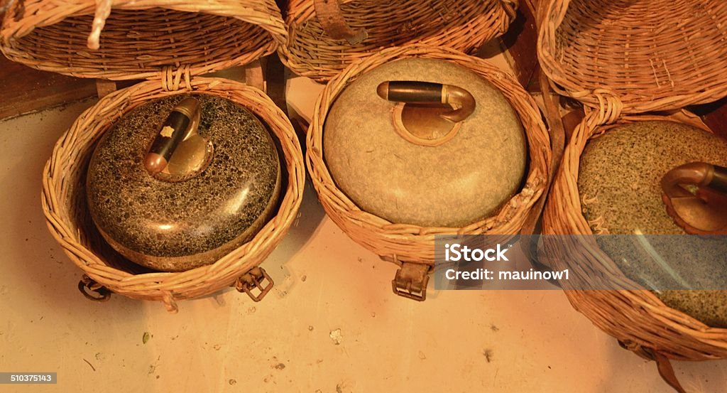 Curling stone with handle Curlings stones in a basket Curling - Sport Stock Photo