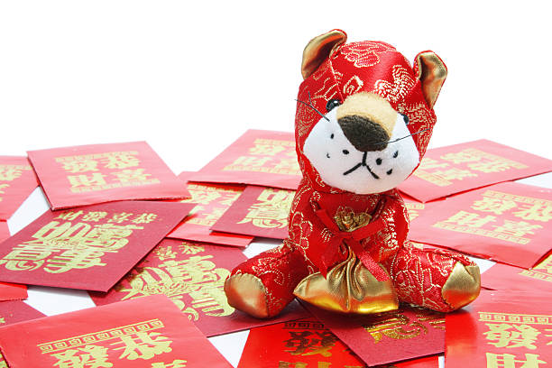 istock Tiger Soft Toy and Red Envelopes 510376443