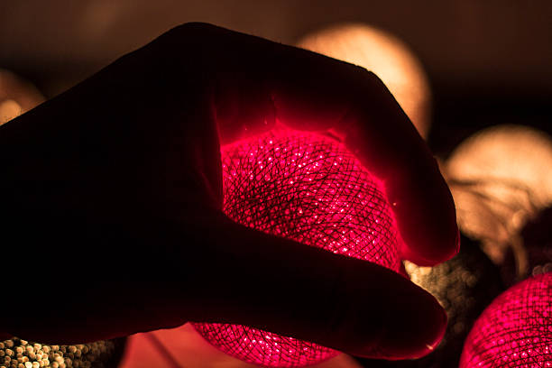 istock Hand holding a Yarn Ball Light decoration 510378649