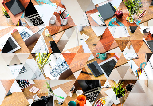 Abstract triangle shaped background: Messy desk of young startup coworking business