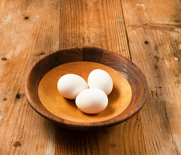 istock Fresh organic white eggs in rustic wooden bowl 510385842