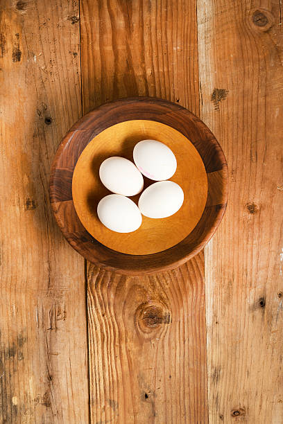 istock Fresh organic white eggs in rustic wooden bowl 510385876