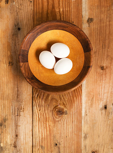 istock Fresh organic white eggs in rustic wooden bowl 510385890