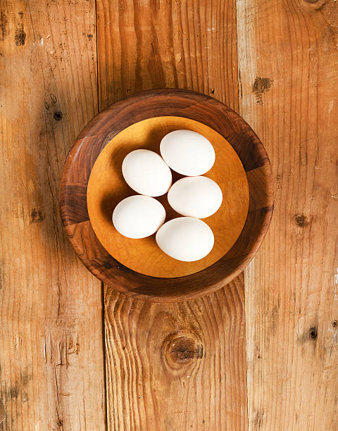 istock Fresh organic white eggs in rustic wooden bowl 510385904
