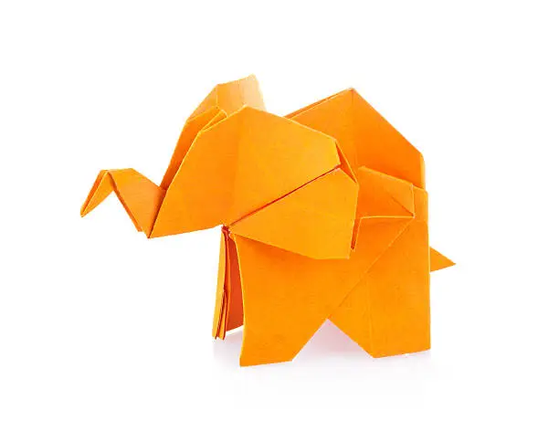 Orange elephant of origami. Isolated on white background