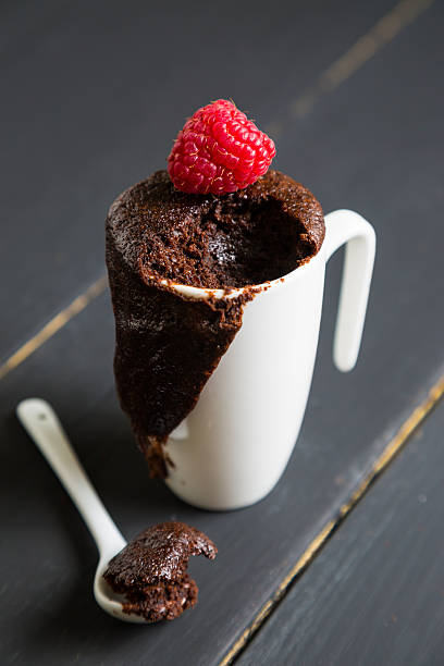 istock Chocolate brownie with fresh raspberries in a mug 510388638