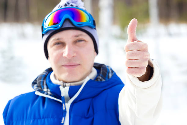 Thumbs up for skiing Skier shows a positive reaction by raising the thumb thumbs up for skiing stock pictures, royalty-free photos & images