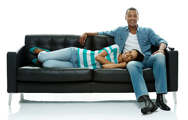 istock Happy couple sitting & lying on couch 510392245
