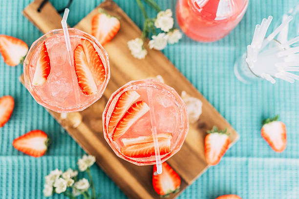 istock Pink summer cocktail drink from above with strawberries 510392414