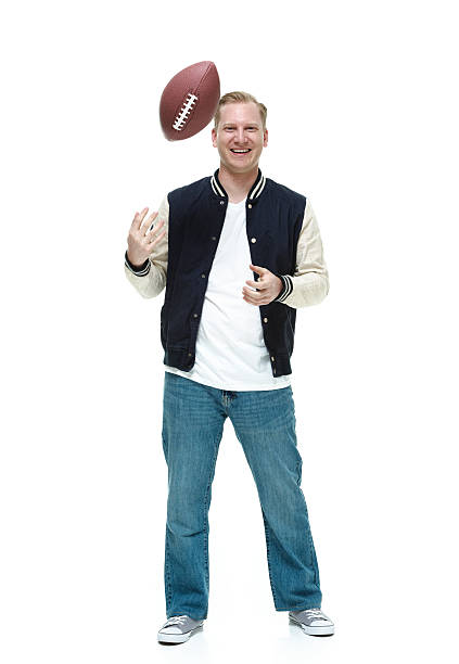istock Cheerful student trowing football 510392461