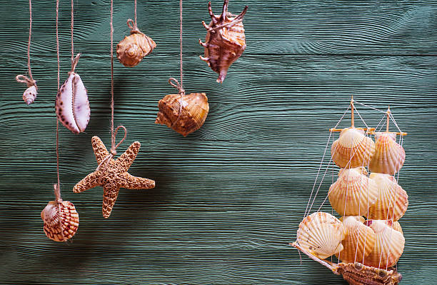 istock Sea composition with ship, seashells, copy space on wooden backg 510394232