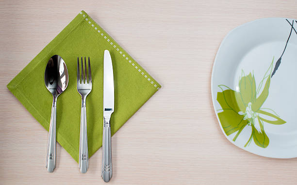 istock green napkin knife fork plate 510394954