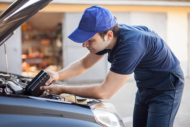 istock Mechanic putting oil in a car engine 510395206