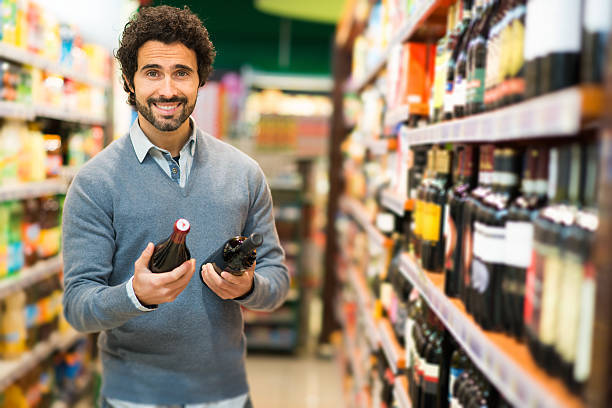 istock Man choosing a wine bottle 510395768