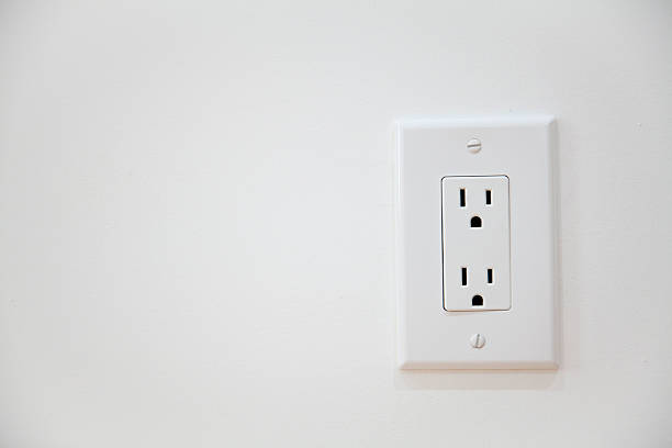 White Electrical Outlet and Wall Plate White Electrical Outlet and Wall Plate at the white wall three pin plug stock pictures, royalty-free photos & images