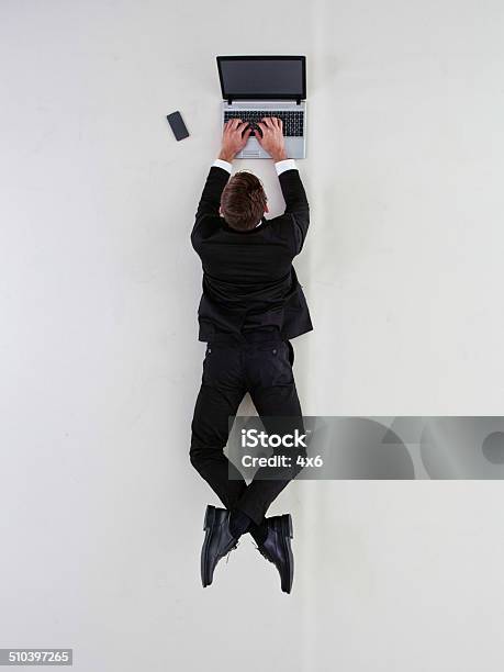 Above View Of Businessman Working On Laptop Stock Photo - Download Image Now - Directly Above, Men, Suit