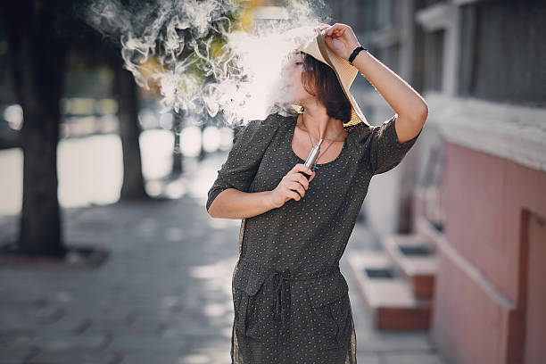 istock Girl with E-cigarette 510397546