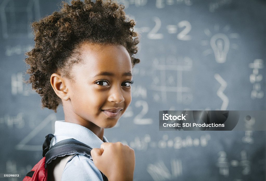 Cute little African school girl in classroom Cute little African school girl in classroom.  Child Stock Photo
