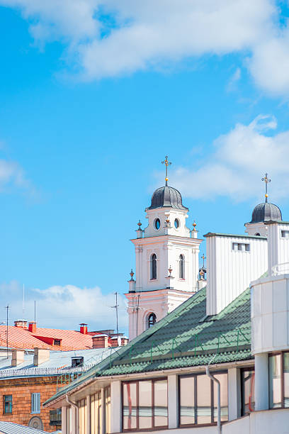 istock rooftops and church steeple against a blue sky 510398058