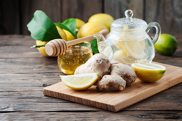 istock Cocktail with ginger, lemon and honey on the wooden table 510399074