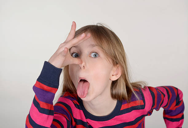 istock girl puts out her tongue 510399096