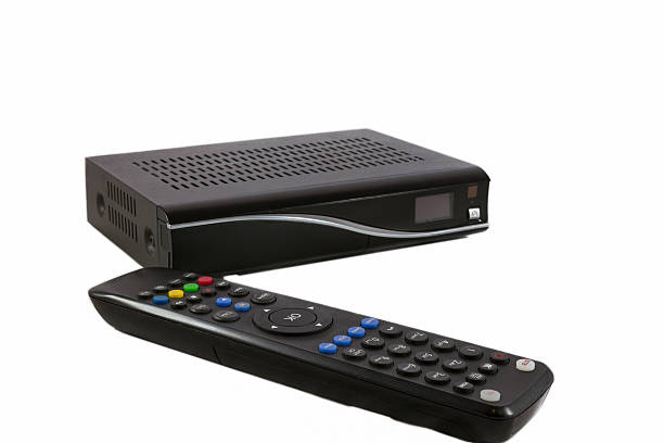 istock Remote and Receiver for Satellite TV on white front view 510400138