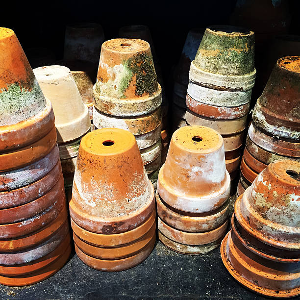 A collection of decorative flower pots and urns outside a Cape Cod shop.