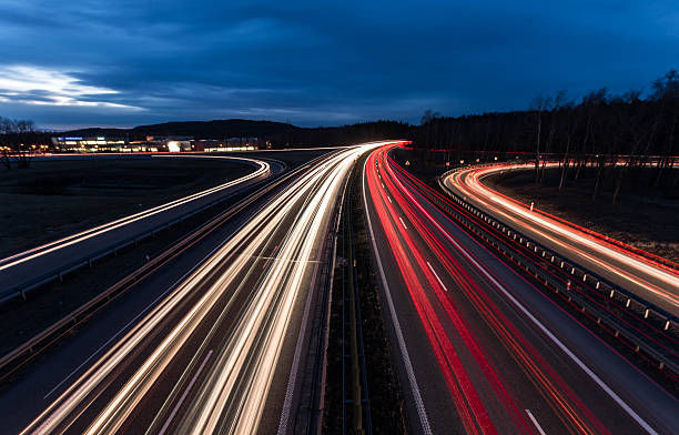 istock white and red car light trails on motorway junction 510402582
