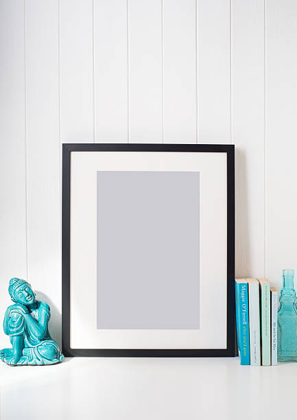 istock Black picture frame on desk 510405928