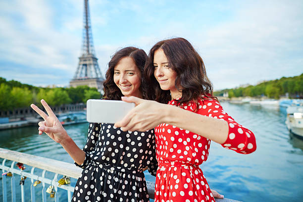 istock Beautiful twin sisters taking selfie 510406580