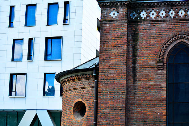 istock modern building and old church 510408400